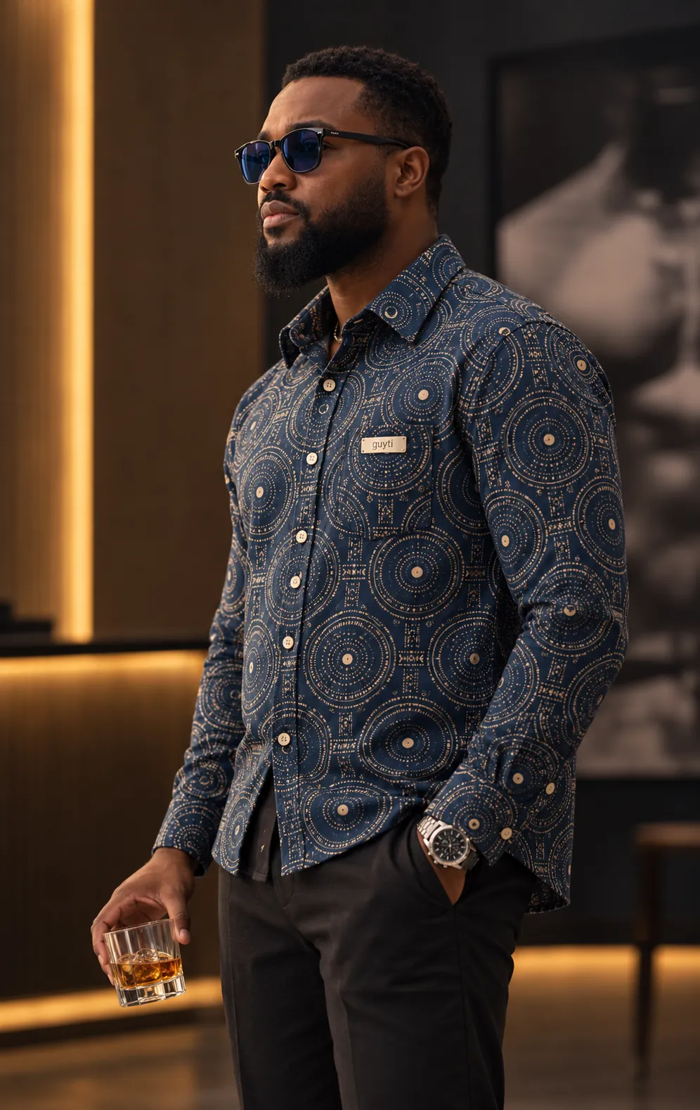 The guyti model in the Indigo Rhythm Shirt, after dark